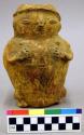 Ceramic effigy vessel, female human form, polychrome, hands crossing chest