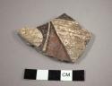 Sherd found with ceramic bowl 44-19-10/27373.  Association unclear.