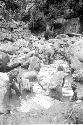 Women and children working in the salt pool at the salt well