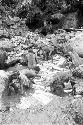 Women and children working in the salt pool at the salt well