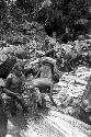 Women and children working in the salt pool at the salt well