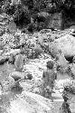 Women and children working in the salt pool at the salt well