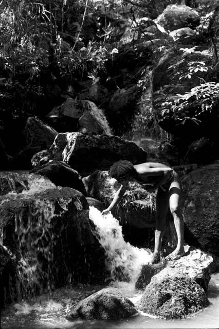 Man by river coming down from the salt wells; he drinks