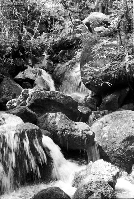 Water rushing down the water course alngside the trail from the wells down the valley floor