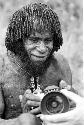 Portrait of Kurelu; he still has Eliot Elisofon's camera