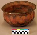 Ceramic bowl, flared rim, black on red exterior, flat base