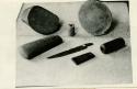 Collection of artifacts, including adze, blade and rock with pictograph