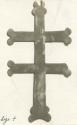 Artifact in shape of cross but with 2 horizontal lines from Ojibwa grave