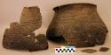Ceramic partial vessel and sherds, corrugated and banded