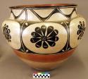 Large olla or storage jar, decorated with panel design of conventional black flo