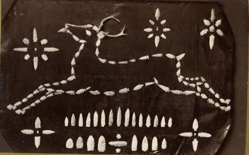 Lithic collection arranged in an outline of a deer and stars