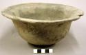 Ceramic bowl with horizontally flared rim, notched notched lip