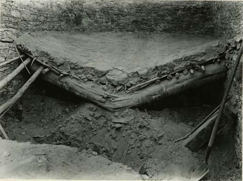 Broken second story floor, showing cracked wooden beam floor