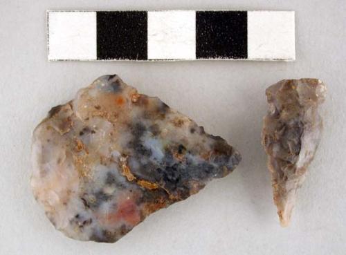 Chipped stone, 1 projectile point side-notched, one biface, ovate