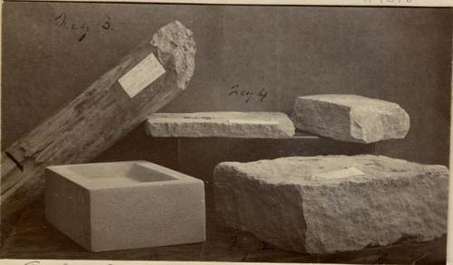 3 stone slabs, one worked stone cube, one piece of wood.
