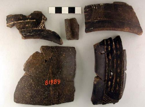 Ceramic sherds, rim/body, polished black ware, incised decoration, repaired