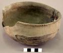 Pottery bowl with notched, flared rim