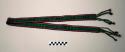 Woven belt in green, crimson, pink and dark blue with braided and tasseled fringe; geometric pattern