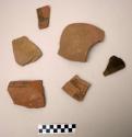 Ceramic rim & body sherds, black on orange design, various, sand temper