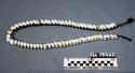Necklace of cypraea shells on braid of human hair