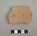 Perforated plate sherd. two perforations (plus one broken along edge) about 3.1 cm. from rim edge; a third perforation broken along edge; plainware.