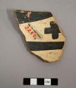 Rim sherd with interior and exterior painted designs--black-on-white. gila polychrome