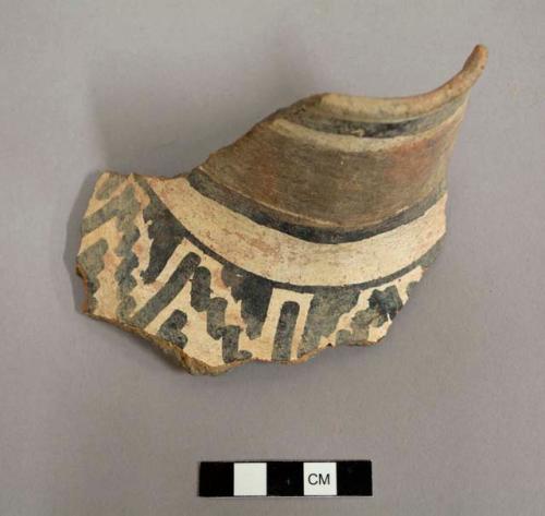 Ceramic rim, neck, & body sherd of a jar, slightly flared rim, narrow mouth, black on white linear and geometric design on exterior, plain interior. gila polychrome