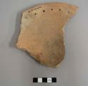 Perforated plate rim sherd (perforations about 1.8 cm. from rim). plainware..