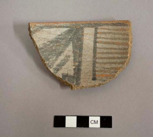 Rim sherd from bowl, black-on-white interior, exterior red slip. gila polychrome