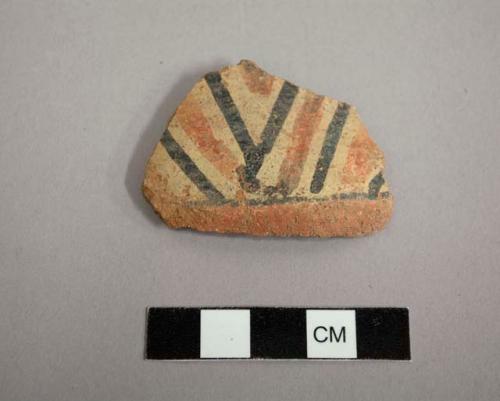 Body sherd from a jar. exterior decorated with linear red, black & white design. tonto polychrome.