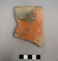 Rim sherd from a straight sided and straight rimmed bowl or vase. Exterior slipped red and fire clouded, interior smudged black - salt smudged