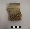 Rim sherd from a  large jar. Corrugated ware.
