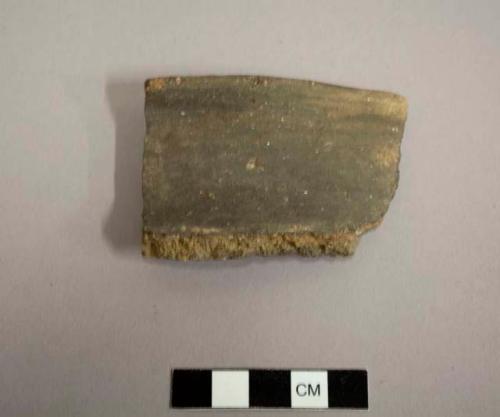 Rim sherd. Brown ware