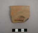 Rim sherd of bowl, exterior red slip, interior black-on-buff. gila polychrome