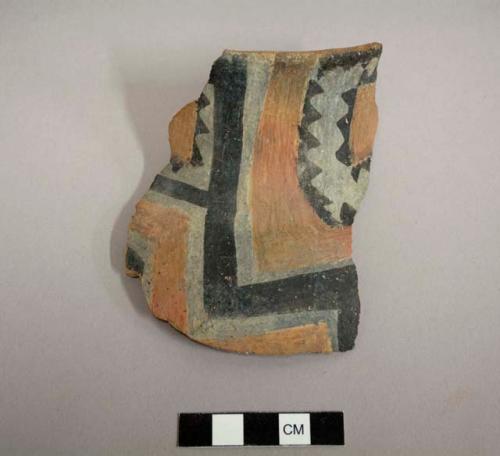 Ceramic rim sherd of a jar. Exterior has linear design of black, white and red - tonto polychrome