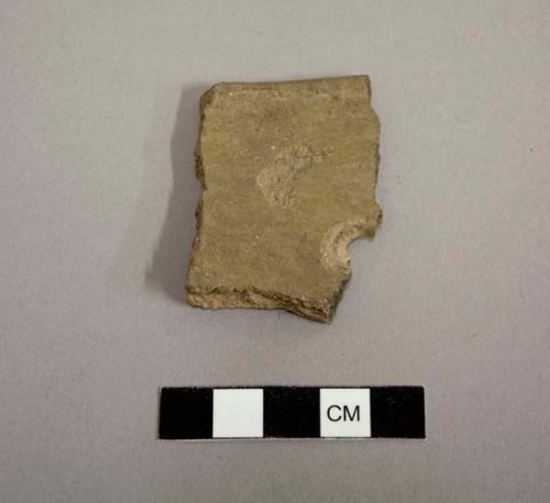 Rim sherd, interior and exterior slipped and polished mottled tan-gray and red, half a single perforation 1.1 cm in diameter - salt red