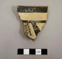 Ceramic rim sherd, black on white interior and exterior, red rim - gila polychrome