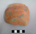 Rim sherd; bowl; outcurved with flat base; exterior slipped red with small fire clouds; interior smudged black - salt smudged.