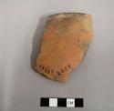 Rim sherd; from outcurved bowl with slightly concave base; small fire clouds; interior/exterior polishing stria; salt smudged.