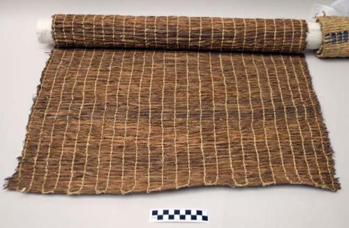 Mat of dead willow bark, natural color, woven with elaeagnus bark twine.