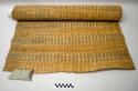 Floor or bed mat woven of rushes and elaeagnus string. Green bands for ornament