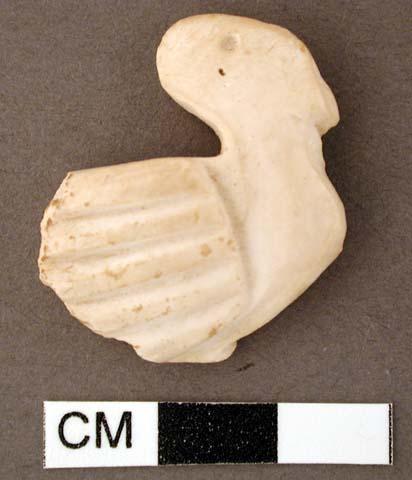 Shell, carved effigy of stylized bird