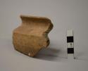 Sherd of  large spouted basin with recurved rim, coarse brown ware