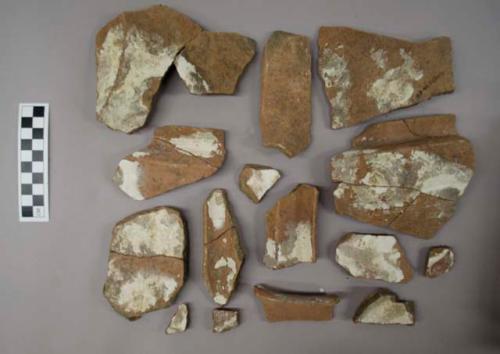 39 sherds of type of large, spouted basin with recurved rim - coarse brown ware