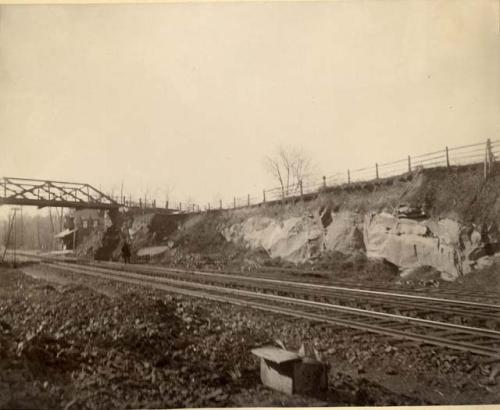 Former site of rock shelter below carpenter station. Railroad cut.