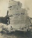 Building at Pueblo Bonito, with man standing at base