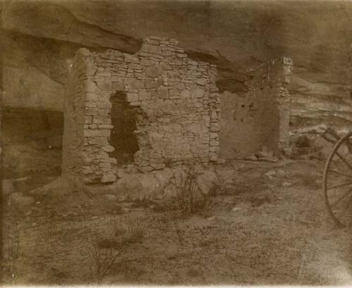 View of small stone structure built at base of cliff