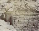 Stone wall, with man standing next to it