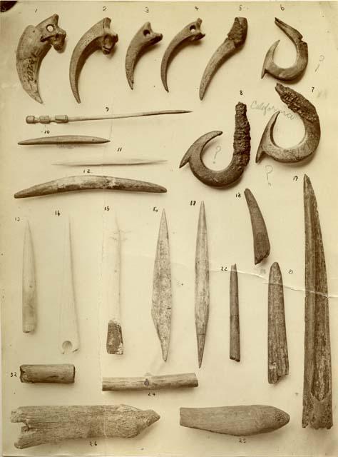 Studio shot of 26 archaeological finds of various shapes and sizes