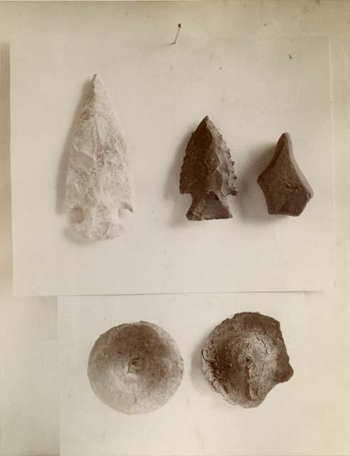 Stone tools and unidentified round object, possibly an earspool